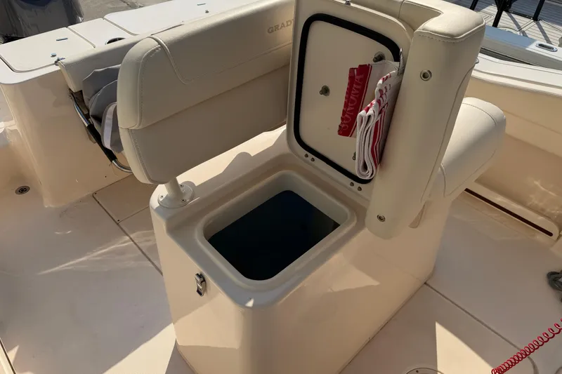 Slide: The Image of 2024 Grady-White Fisherman 236 boat seat with storage compartment open. - 32