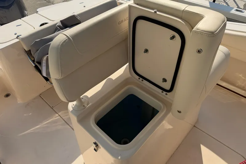Slide: The Image of 2024 Grady-White Fisherman 236 boat interior with open storage compartment. - 33