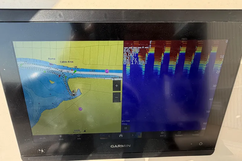 Slide: The Image of Garmin marine display on 2024 Grady-White Fisherman 236 showing navigation and sonar data. - 39