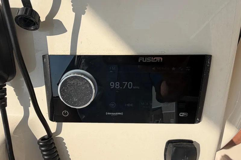 Slide: The Image of Fusion marine stereo on 2024 Grady-White Fisherman 236, displaying FM 98.70 MHz. - 44