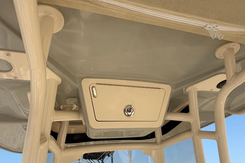 Slide: The Image of 2024 Grady-White Fisherman 236 boat interior ceiling with storage compartment. - 52