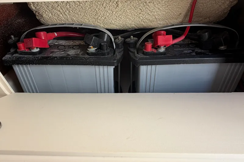 Slide: The Image of Batteries installed in a 2024 Grady-White Fisherman 236 boat compartment. - 55