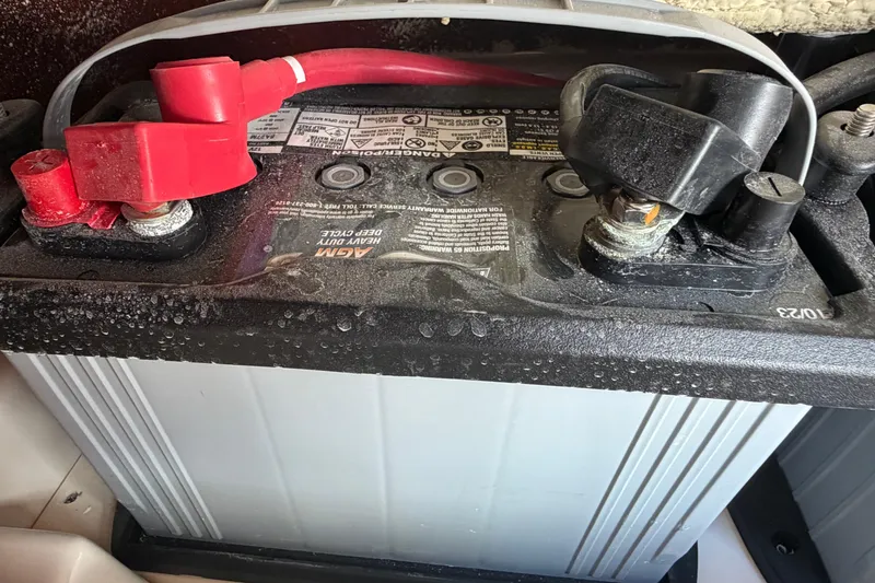 Slide: The Image of Battery connections on a 2024 Grady-White Fisherman 236 boat. - 57