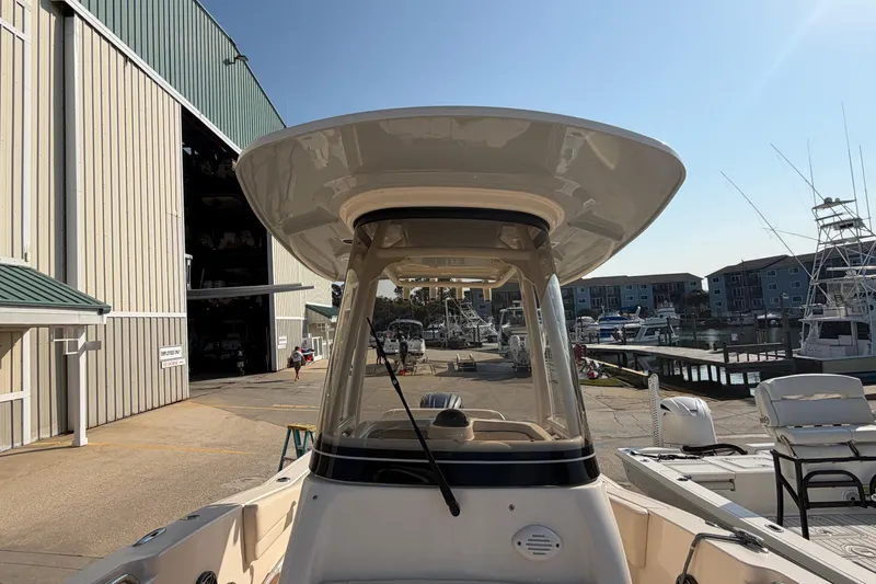 Slide: The Image of 2024 Grady-White Fisherman 236 boat docked at a marina under clear skies. - 67