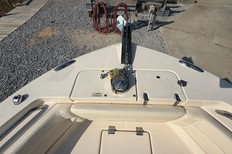 Slide: The Image of 2024 Grady-White Fisherman 236 boat deck with anchor and storage compartments. - 69