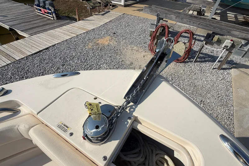 Slide: The Image of 2024 Grady-White Fisherman 236 boat anchor system on deck, dockside view. - 71