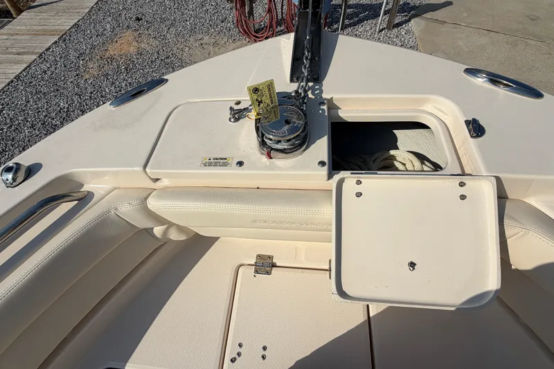 Slide: The Image of 2024 Grady-White Fisherman 236 boat deck with anchor storage and seating area. - 72