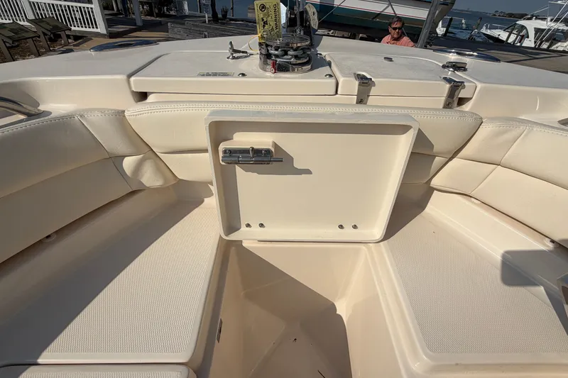Slide: The Image of 2024 Grady-White Fisherman 236 boat interior with seating and storage compartment. - 74