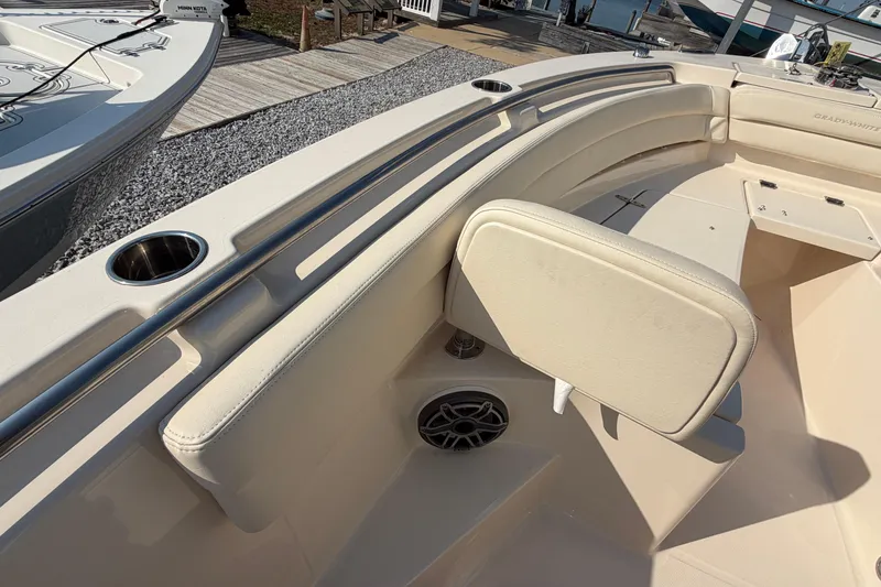 Slide: The Image of 2024 Grady-White Fisherman 236 boat interior with cushioned seating and cup holders. - 78