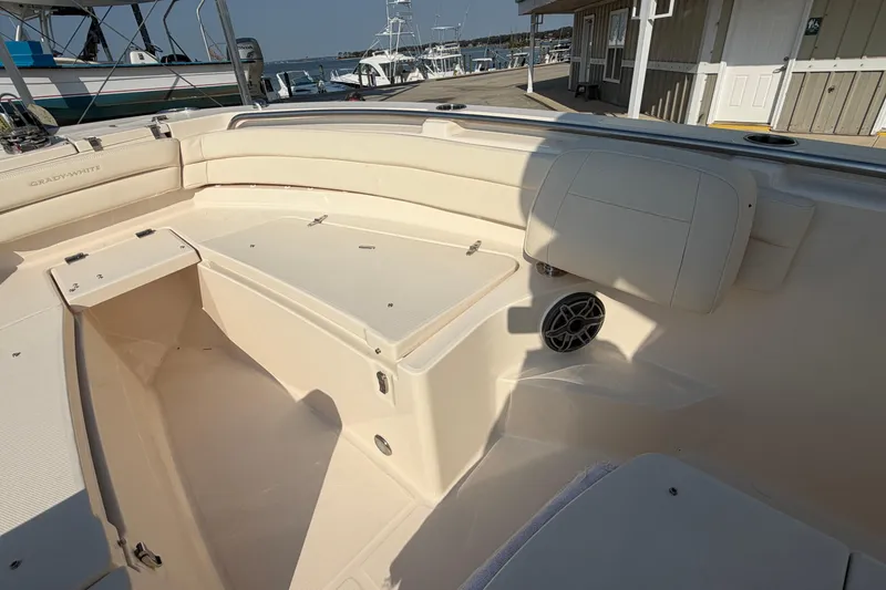 Slide: The Image of 2024 Grady-White Fisherman 236 boat interior with seating and storage compartments. - 79