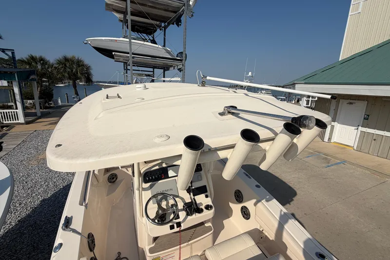 Slide: The Image of 2024 Grady-White Fisherman 236 boat with rod holders and steering console. - 82