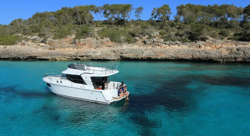 Slide: The Image of Manufacturer Provided Image: 2020 Beneteau Swift Trawler 30 cruising on open water, showcasing sleek design and performance. - 15