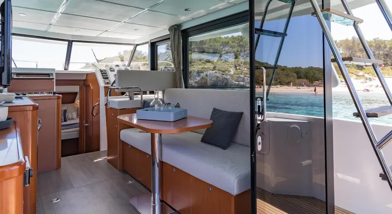 Slide: The Image of Manufacturer Provided Image: 2020 Beneteau Swift Trawler 30 cruising on calm waters at sunset. - 20