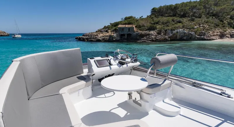 Slide: The Image of Manufacturer Provided Image: 2020 Beneteau Swift Trawler 30 cruising on open water, showcasing sleek design and performance. - 9