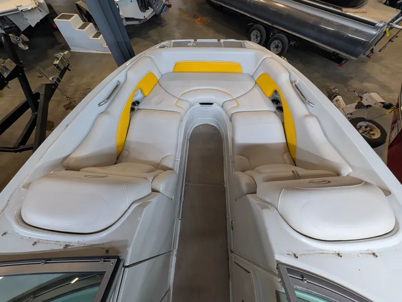 Slide: The Image of Interior of a 2015 Crownline Eclipse E6 boat with yellow accents. - 10