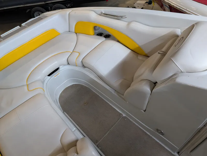 Slide: The Image of Interior of a 2015 Crownline Eclipse E6 boat with yellow accents. - 11
