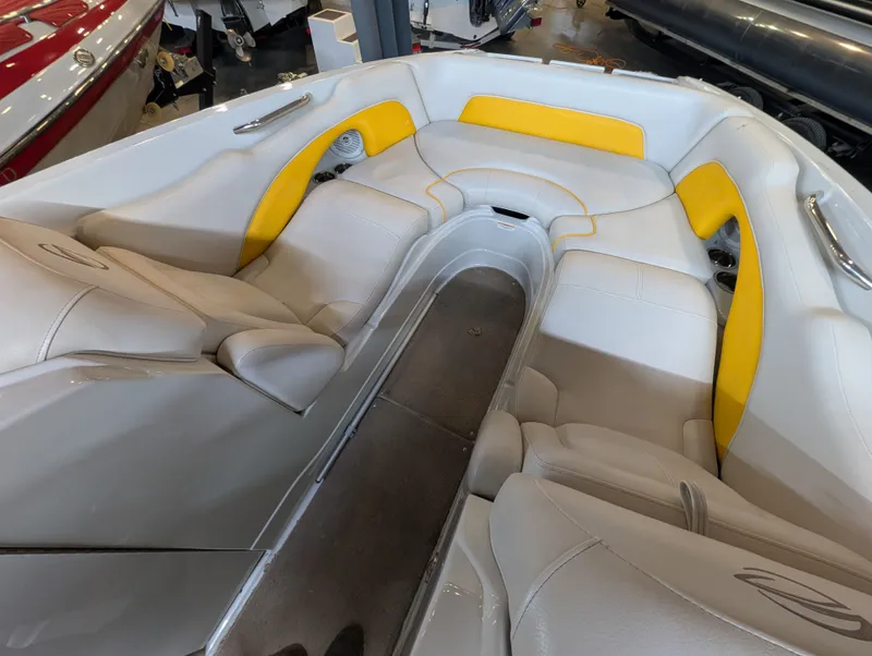 Slide: The Image of Interior of a 2015 Crownline Eclipse E6 boat with yellow accents. - 12
