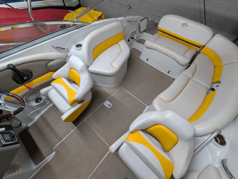 Slide: The Image of Interior of a 2015 Crownline Eclipse E6 boat with yellow accents. - 13