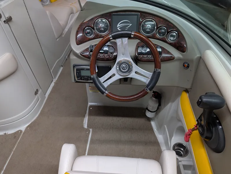 Slide: The Image of Interior of 2015 Crownline Eclipse E6 with steering wheel and dashboard. - 14