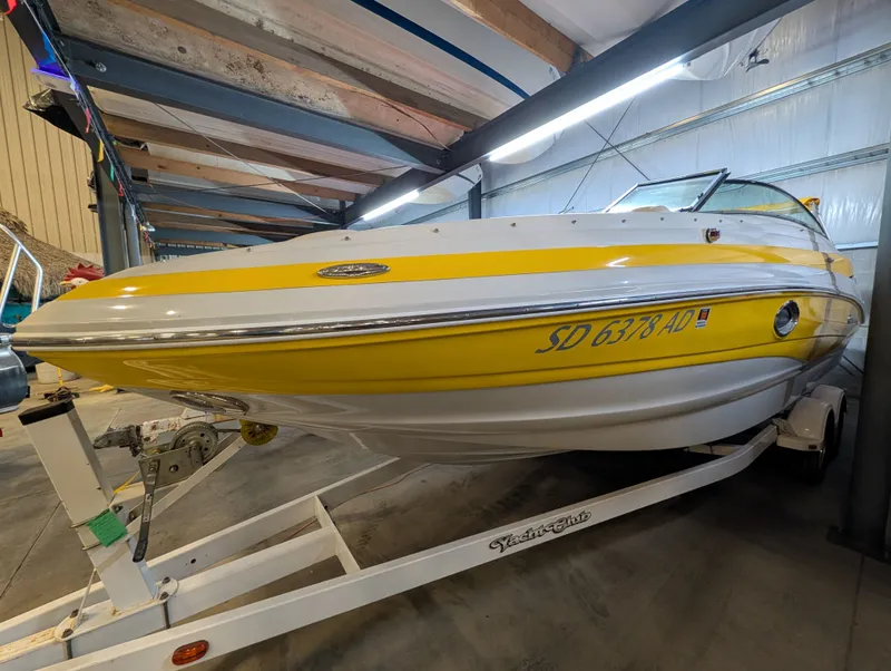 Slide: The Image of 2015 Crownline Eclipse E6 boat in yellow and white design on trailer. - 5