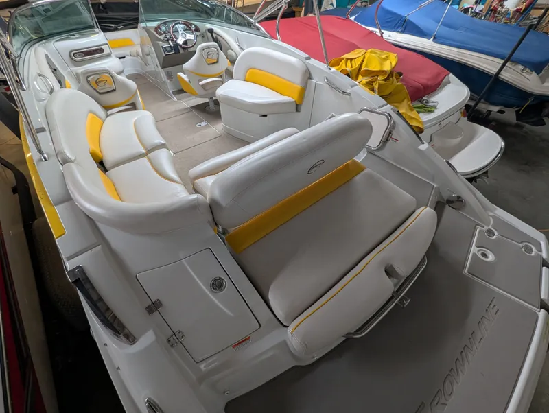 Slide: The Image of Interior view of a 2015 Crownline Eclipse E6 boat with yellow accents. - 8
