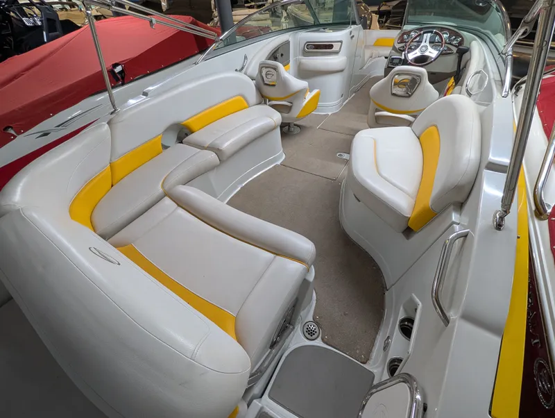 Slide: The Image of Interior of a 2015 Crownline Eclipse E6 boat with yellow accents. - 9