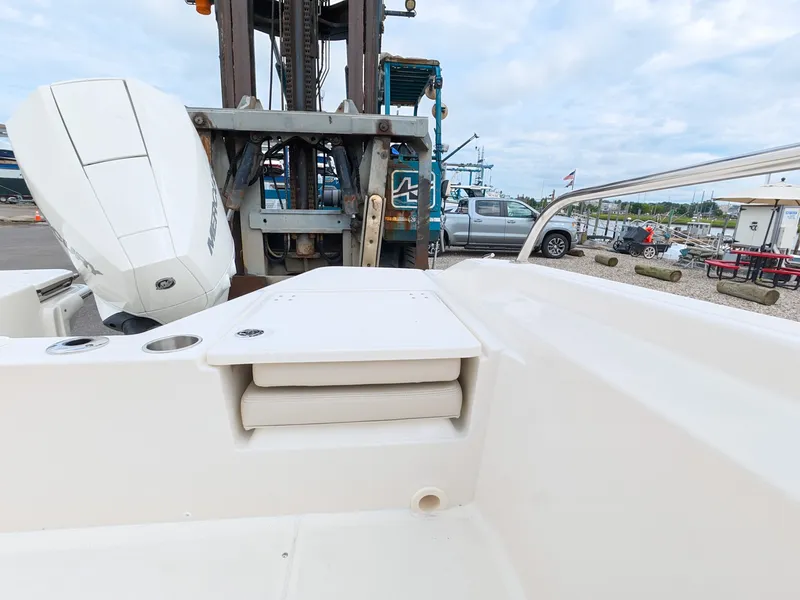 Slide: The Image of The image shows the stern of a Boston Whaler 220 Dauntless with an outboard motor. - 7