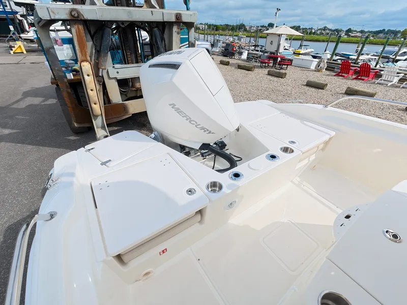 Slide: The Image of The image shows the stern of a Boston Whaler 220 Dauntless with a Mercury outboard motor. - 5