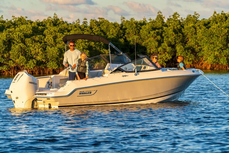 Slide: The Image of Boston Whaler 210 Vantage 2026 on calm waters with passengers. - 3