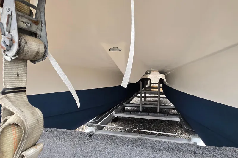 Slide: The Image of Underneath view of a 2005 World Cat 250 DC boat on a trailer. - 11