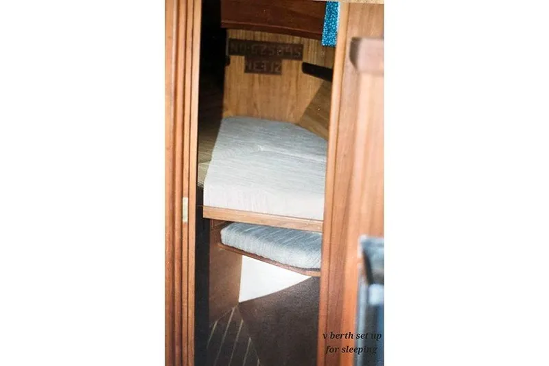 Slide: The Image of Interior view of 1980 Cape Dory 33 sailboat with cozy sleeping berth. - 14