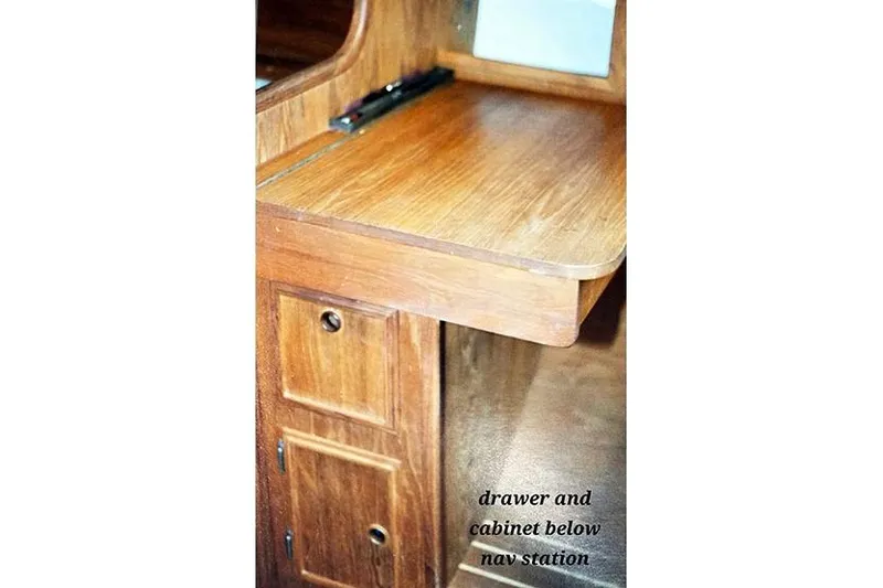 Slide: The Image of Wooden navigation station with drawers and cabinet on a 1980 Cape Dory 33 sailboat. - 16