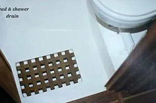 Slide: The Image of 1980 Cape Dory 33 boat bathroom with wooden shower drain and toilet. - 18