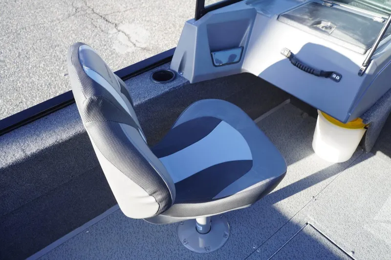 Slide: The Image of 2026 Lowe Fishing Machine 1625WT interior with swivel seat and console. - 19