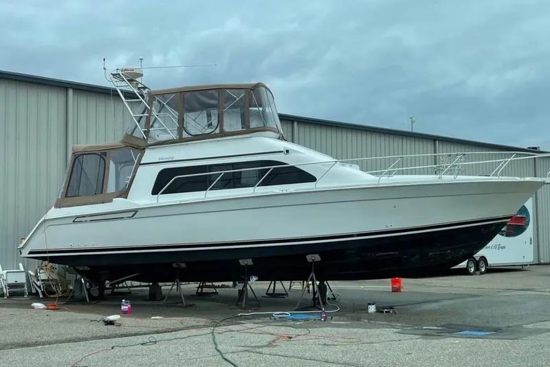 The Image of 1996 Mainship 40 Sedan Bridge yacht on dry dock, ready for maintenance. - 1
