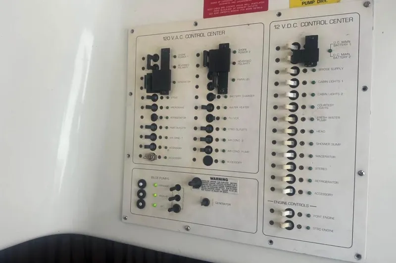 Slide: The Image of Electrical control panel on a 1996 Mainship 40 Sedan Bridge boat. - 11