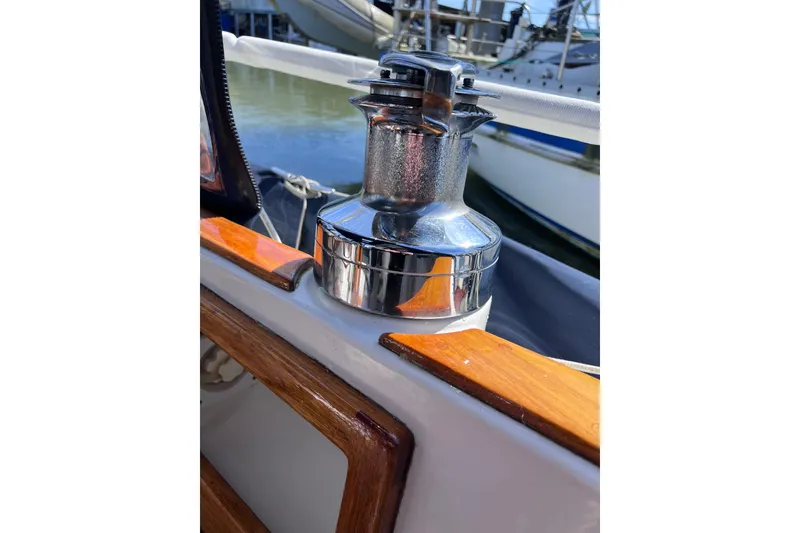 Slide: The Image of Polished winch on 1990 Cabo Rico 38R sailboat, docked in marina. - 19