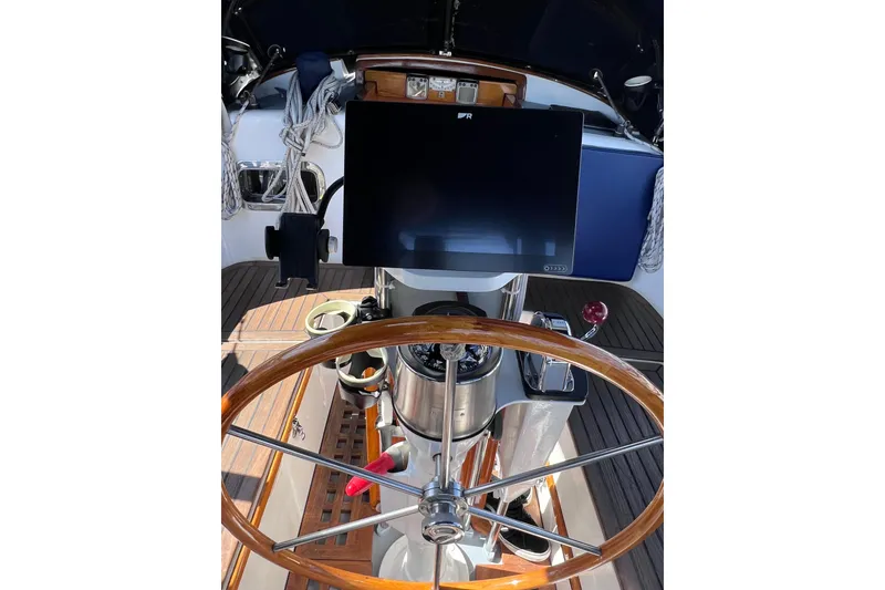 Slide: The Image of Steering wheel and navigation equipment on a 1990 Cabo Rico 38R sailboat. - 22