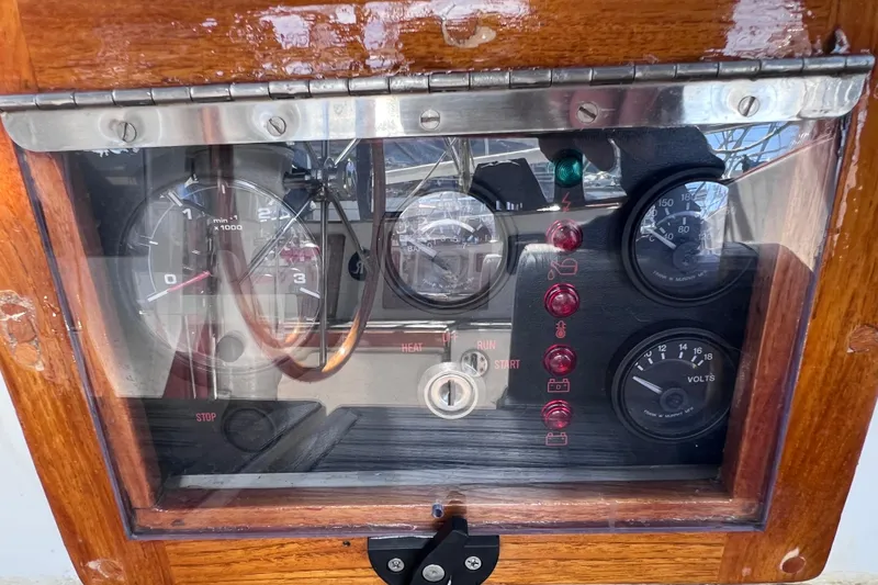 Slide: The Image of Control panel of a 1990 Cabo Rico 38R sailboat with gauges and indicators. - 25