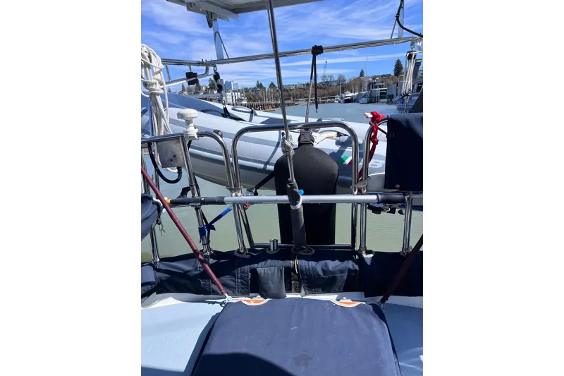Slide: The Image of Sailboat Cabo Rico 38R, 1990 model, docked with visible rigging and equipment. - 27