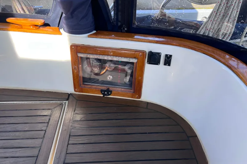 Slide: The Image of Interior of a 1990 Cabo Rico 38R sailboat with wooden accents and control panel. - 28