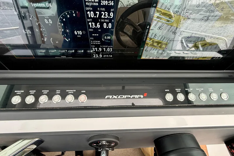 Slide: The Image of Dashboard of 2023 Axopar 28 Cabin boat with control panel and digital display. - 33