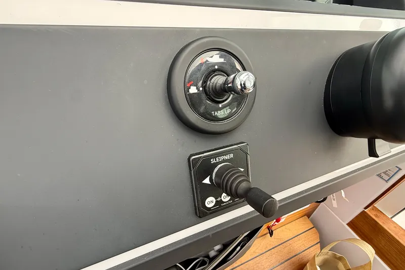 Slide: The Image of Control panel of 2023 Axopar 28 Cabin boat with joystick and thruster controls. - 34