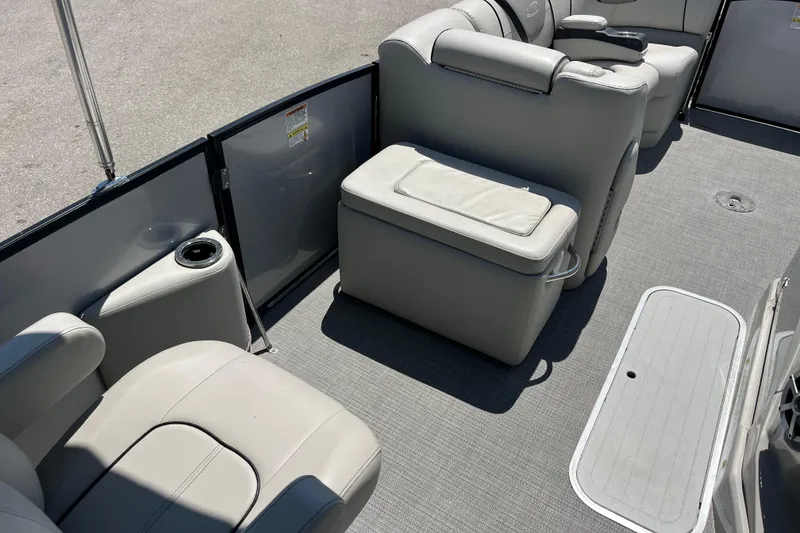 Slide: The Image of 2017 Sylvan Mandalay 8525 Sportlounger Twin interior with gray seating and flooring. - 12