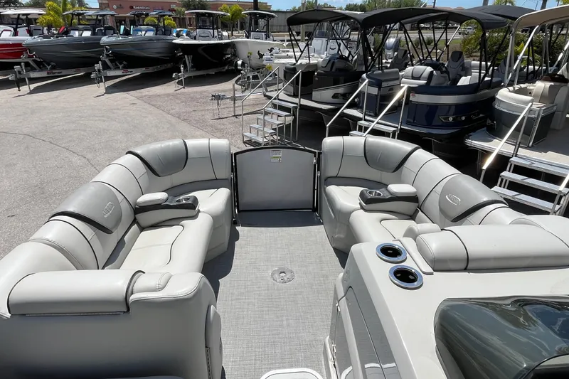 Slide: The Image of 2017 Sylvan Mandalay 8525 Sportlounger Twin pontoon boat with luxurious seating and cup holders. - 13