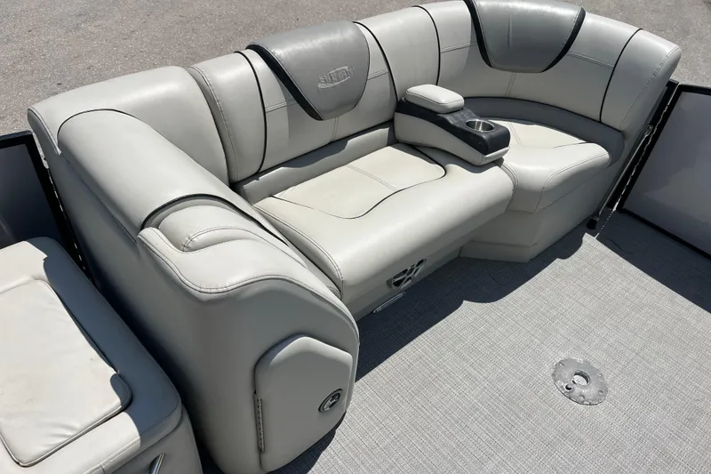 Slide: The Image of 2017 Sylvan Mandalay 8525 Sportlounger Twin boat interior with gray seating and cup holder. - 15