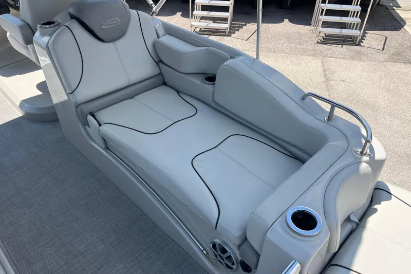 Slide: The Image of Luxurious seating on 2017 Sylvan Mandalay 8525 Sportlounger Twin boat, featuring sleek gray upholstery. - 9