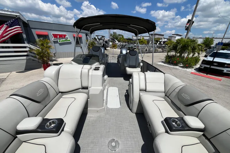 Slide: The Image of 2017 Sylvan Mandalay 8525 Sportlounger Twin pontoon boat with luxurious seating and canopy. - 16