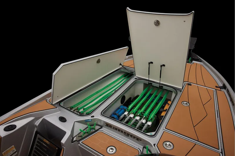 Slide: The Image of Manufacturer Provided Image: 2026 Ranger Z520R Ultra boat storage compartments with organized green rods and equipment. - 21