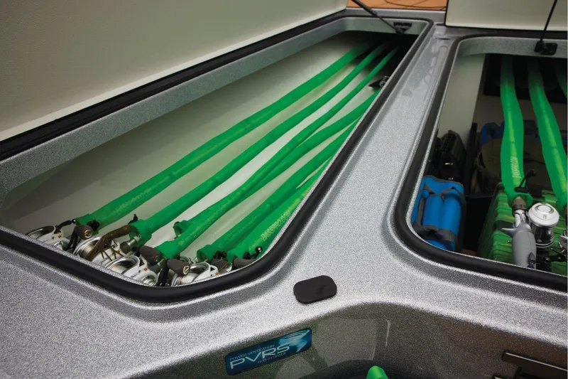 Slide: The Image of Manufacturer Provided Image: Storage compartments in 2026 Ranger Z520R Ultra boat, featuring organized fishing rods and gear. - 23